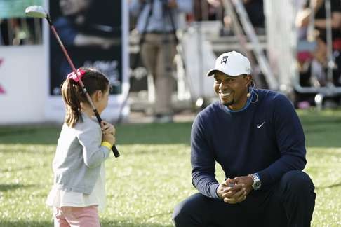 Woods’ is the patron ofhis own charitable foundation. Photo: EPA