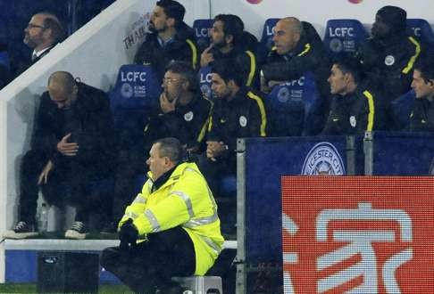 Manchester City manager Josep Guardiola sits dejected after the 4-2 hammering at Leicester. Photo: AP