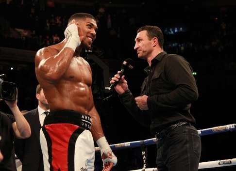 Klitschko enters the ring and asks the crowd if they want to see him fight Joshua. Photo: EPA