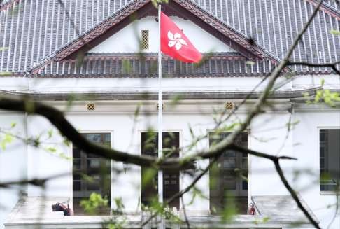 Leung Chai-yan, the second daughter of the chief executive, is seen slumped against a wall (left) at Government House in March 2015. Chai-yan is understood to have been a patient at the Prince of Wales Hospital in Sha Tin for at least a month. Photo: Sam Tsang