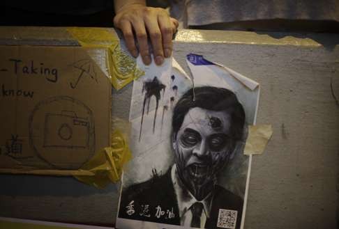 In October 2014: A defaced portrait of Leung Chun-ying at a protest site during Occupy Central. Photo: AP