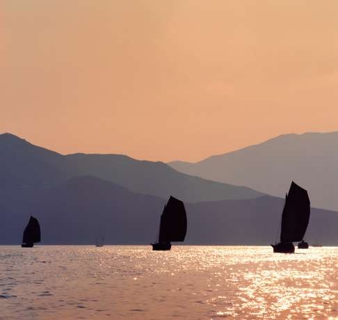 Junks in Tat Hong Channel at sunset, Hong Kong in 1974. Photo: Keith Macgregor