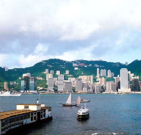 A junk and a Star Ferry in Victoria Harbour looking towards Central in 1982. Photo: Keith Macgregor