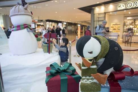 Puffins form part of the Christmas decorations at the IFC mall in Central. Photo: Antony Dickson