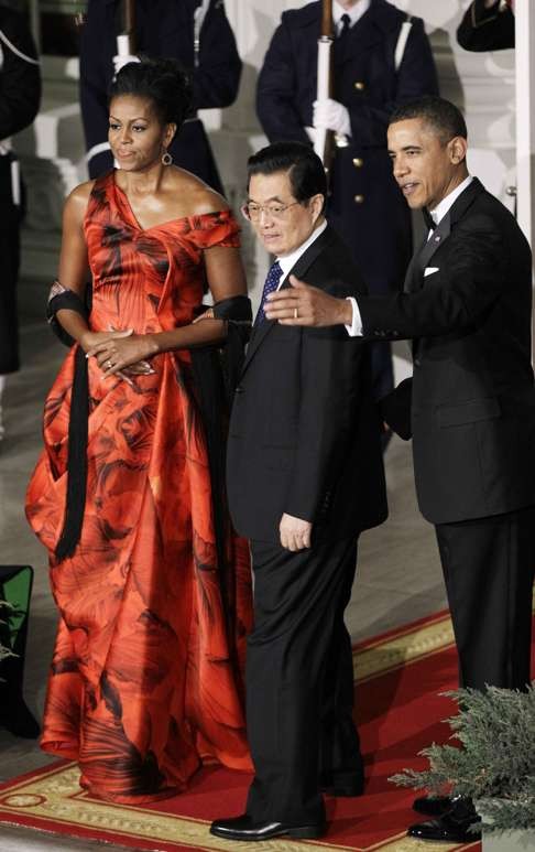 Michelle Obama, wearing Alexander McQueen, Hu Jintao and Barack Obama at the White House in 2011. Photo: AP