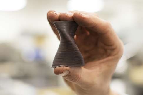 A technician displays a 3D printed chocolate at the Barry Callebaut AG Institute in Wieze, Belgium. Photo: Bloomberg