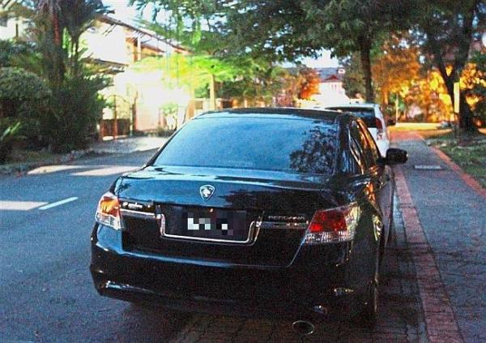 A Proton Perdana is seen parked outside the house of Mohd Arif. Photo: The Star