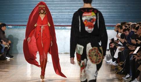 Vivienne Westwood creations on the catwalk during London’s fashion week for men. Photo: EPA