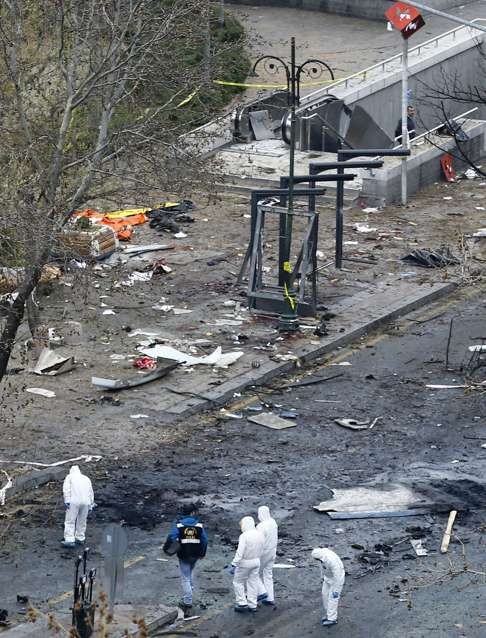 Turkish investigators examine the site a day after an explosion near a bus station killed 34 people and left 125 others wounded in Ankara on March 13 last year. The carnage at the Reina nightclub in Istanbul in the early hours of the New Year was a continuation of the wave of terrorist assaults that have ravaged Turkey. Photo: EPA