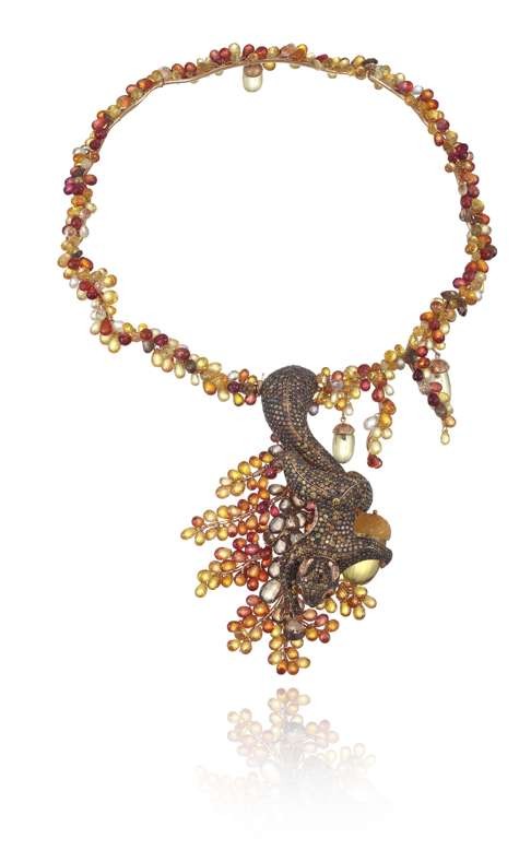 Chopard. Heavily set with colourful gemstones and diamonds, the necklace features a vivid depiction of a squirrel crawling down hunting for acorns. Price on request