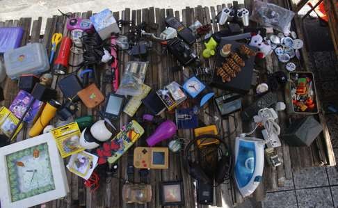 Second-hand electronics sold on a street in Bangkok. Photo: AP