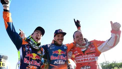 British Dakar Motorbike race winner Sam Sunderland (centre) celebrates with Austrian biker Matthias Walkner (left) and Spain's Gerard Guell Farres. Photo: AFP