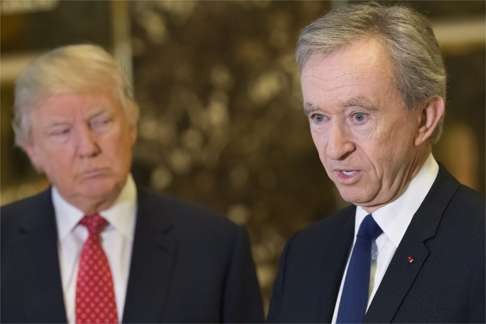 Trump (left) and Arnault in the lobby of Trump Tower. Photo: EPA