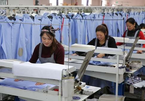 Women working in a shirt factory in Jiangsu province. Photo: AFP