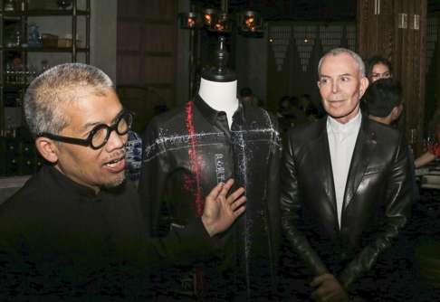 Artist Stanley Wong (left), known as Anothermountainman, with French designer Jean-Claude Jitrois.