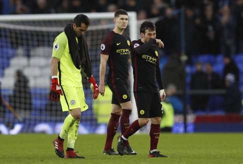 Manchester City's Claudio Bravo, John Stones and David Silva look dejected after the defeat by Everton. Photo: Reuters