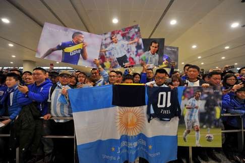 Hundreds of fans gathered at Shanghai Pudong International Airport for Tevez’s arrival. Photo: AFP
