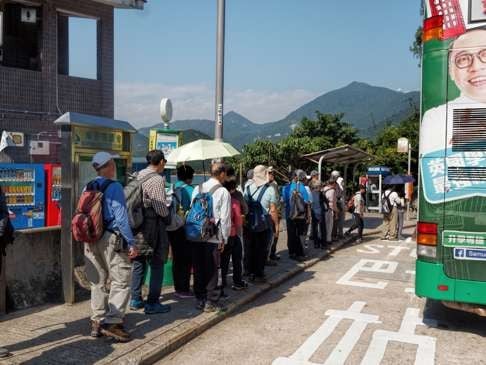 Hikers queuing for a bus at Tai Tam Tuk Reservoir. Photo: Martin Williams