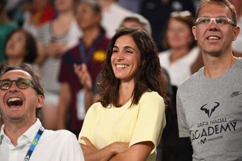 Xisca Perello, girlfriend of Rafael Nadal, smiles after getting mentioned in his victory speech. Photo: AFP