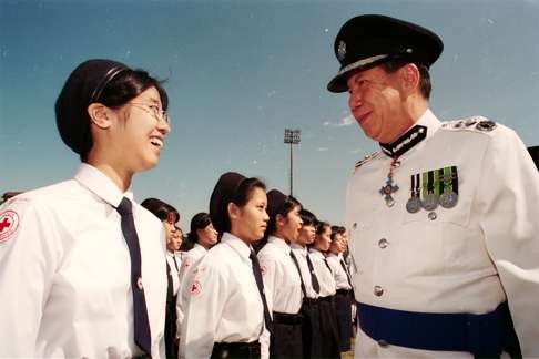 A file picture of then police commissioner Li Kwan-ha (right) chatting with a Hong Kong Red Cross cadet at the organisation's annual passing-out parade. Photo: SCMP