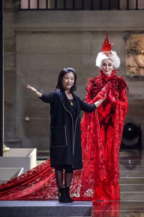 Guo Pei appears on the catwalk with Carmen Dell'Orefice after the presentation of her collection in Paris. Photo: EPA