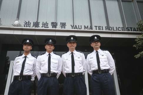 (From left) Station sergeant Leung Sai-cheong, inspector Lau Kwan-ho, acting assistant division commander Lee Hing-yeung and station sergeant Lok Yee-shing. Photo: K. Y. Cheng