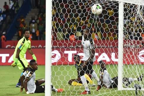 Ghana goalkeeper Brimah Razak and defenders John Boye and Daniel Amartey watch as Cameroon’s second goal goes in. Photo: AFP