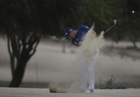 Lee Westwood of England plays a shot on the 14th hole. Photo: AP