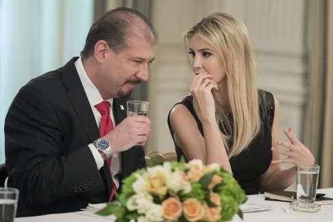 CEO of Ernst & Young Mark Weinberger listening to Ivanka Trump. Photo: EPA