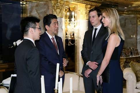 Japanese Prime Minister Shinzo Abe being welcomed by Ivanka Trump and her husband Jared Kushner on November 17, 2016. Photo: AFP