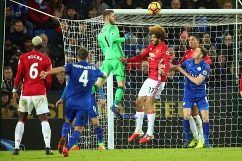 Marouane Fellaini challenges for the ball against Leicester City. Photo: EPA