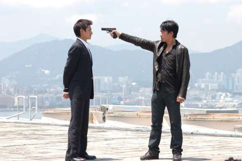 Andy Lau (left) and Tony Leung in Infernal Affairs (2002).