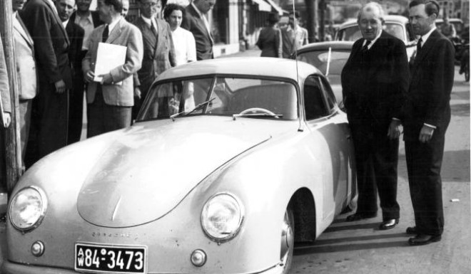 Austrian-German entrepreneur and car designer Ferdinand "Ferry" Porsche, right, with his father Ferdinand next to a Porschesports car. Photo: AP