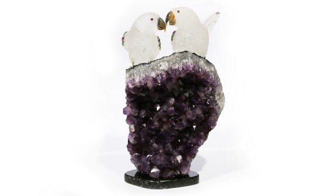 A unique decorative item with rare mineral specimen incorporated into sculpture.