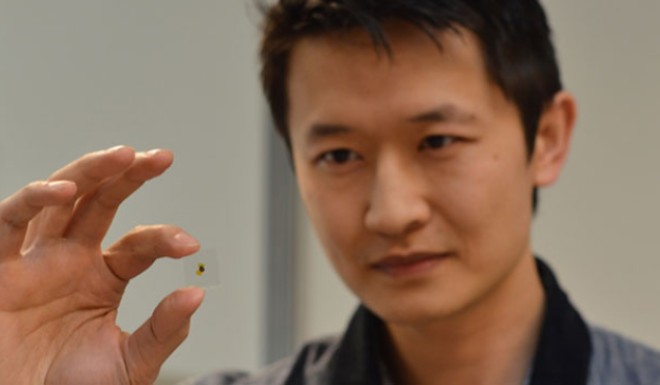 UBC Associate Professor Kenneth Chau demonstrates the breakthrough in smart glass.
