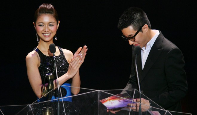 Celebrity Fiona Sit, left, hands out an award at a ceremony. In 2012, she went public about her battle with depression. Photo: Sam Tsang/SCMP