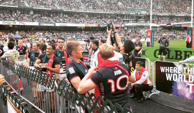 The Hong Kong Sevens Squad takes photos with players after their final match. Photo: Adam White