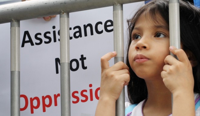 Ameena Butt, 7, a refugee from Pakistan joins a protest against the city's poor treatment to refugees. Photo: Felix Wong/SCMP)