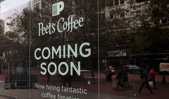 A 'now hiring' sign is posted outside of Peet's Coffee in San Francisco, California. Photo: AFP