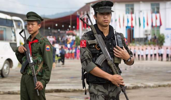 Rebels from Myanmar’s Kachin Independence Army secure a compound where ethnic rebel leaders and representatives gathered for a four-day summit in the war-hit, KIA-controlled border town of Mai Ja Yang, in northern Kachin state, on July 28. Photo: AFP