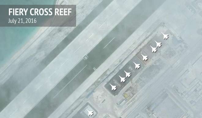 Aircraft hangars that, according to the Centre for Strategic and International Studies (CSIS), have room for any fighter jet in the Chinese air force are seen on Fiery Cross Reef in the Spratly islands, in the disputed South China Sea. Photo: Reuters