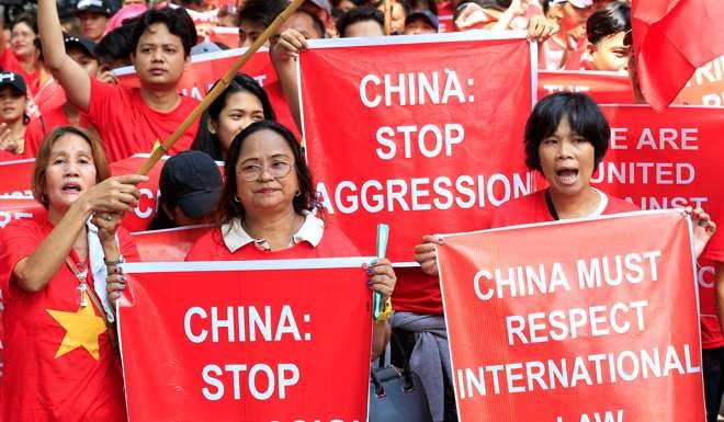 Filipino and Vietnamese activists display placards during a rally over the South China Sea disputes in front of a Chinese Consulate in Makati city, metro Manila, this month. Photo: Reuters