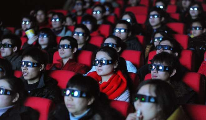 Chinese moviegoers wear 3-D glasses as they watch the science-fiction blockbuster Avatar in Hefei, Anhui province. Photo: AFP