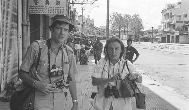 Hollingworth with British photographer Tim Page in Saigon during the 1968 Tet offensive.