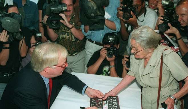 Chris Patten signs a copy of his book about his time as Hong Kong’s last governor for Clare Hollingworth, then 87, at the FCC in 1998. It was said that they were the two people every British journalist covering the return of Hong Kong to Chinese rule wanted to meet. Picture: SCMP