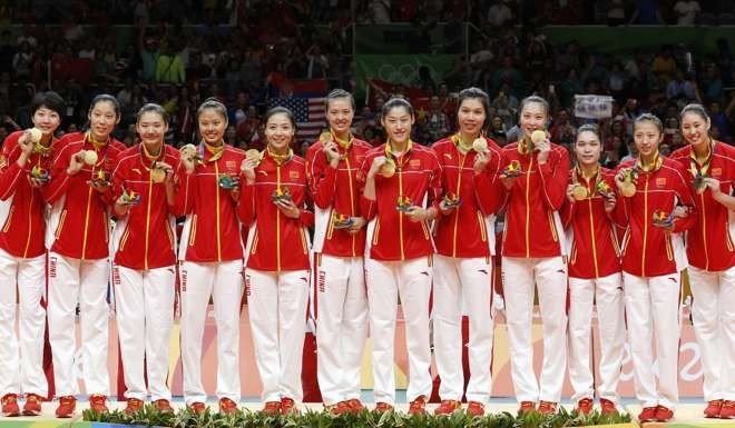 China pose on the podium during the ceremony for the women's volleyball tournament. Photo: EPA