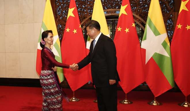 President Xi Jinping greets Myanmar State Counsellor Aung San Suu Kyi at the Diaoyutai State Guesthouse in Beijing on August 19. Photo: EPA