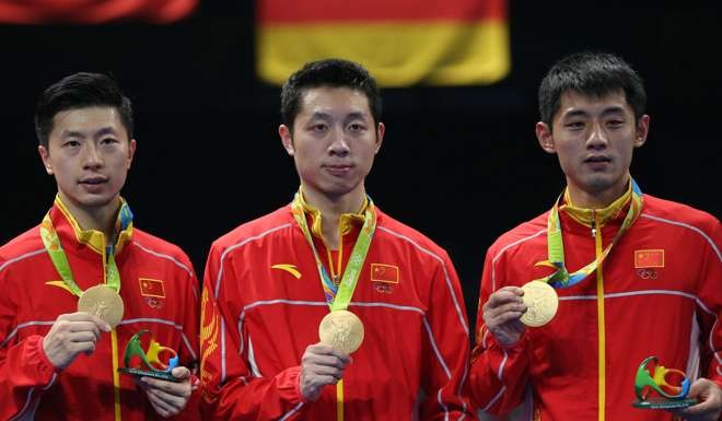 Ma Long (left), Xu Xin and Zhang Jike. Photo: EPA