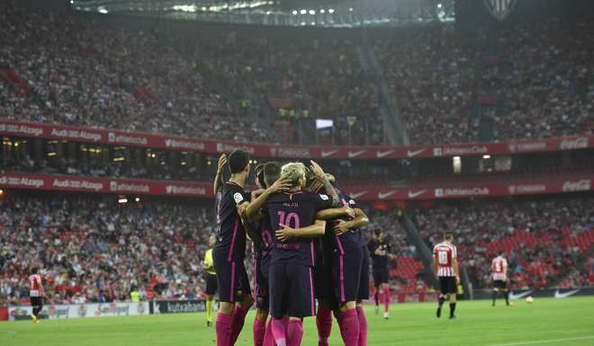 Barcelona players celebrate Ivan Rakitic’s goal during 1-0 win over Athletic Bilbao. Photo: AP