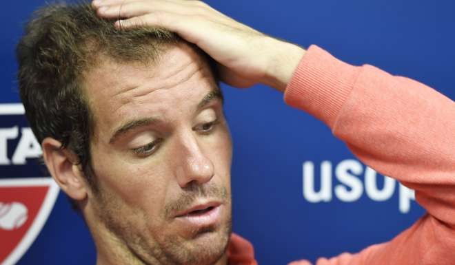 Gasquet speaks to the media after being upset on the first day of the US Open. Photo: EPA